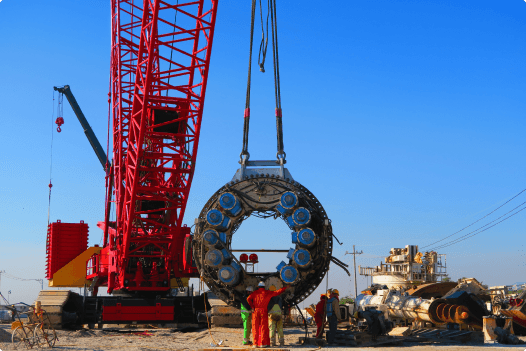 Industrial crane lifting heavy equipment
